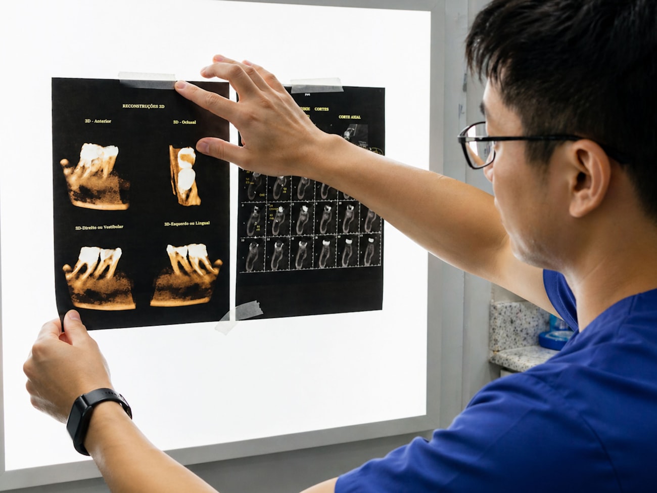 Dentist reviewing dental x-rays